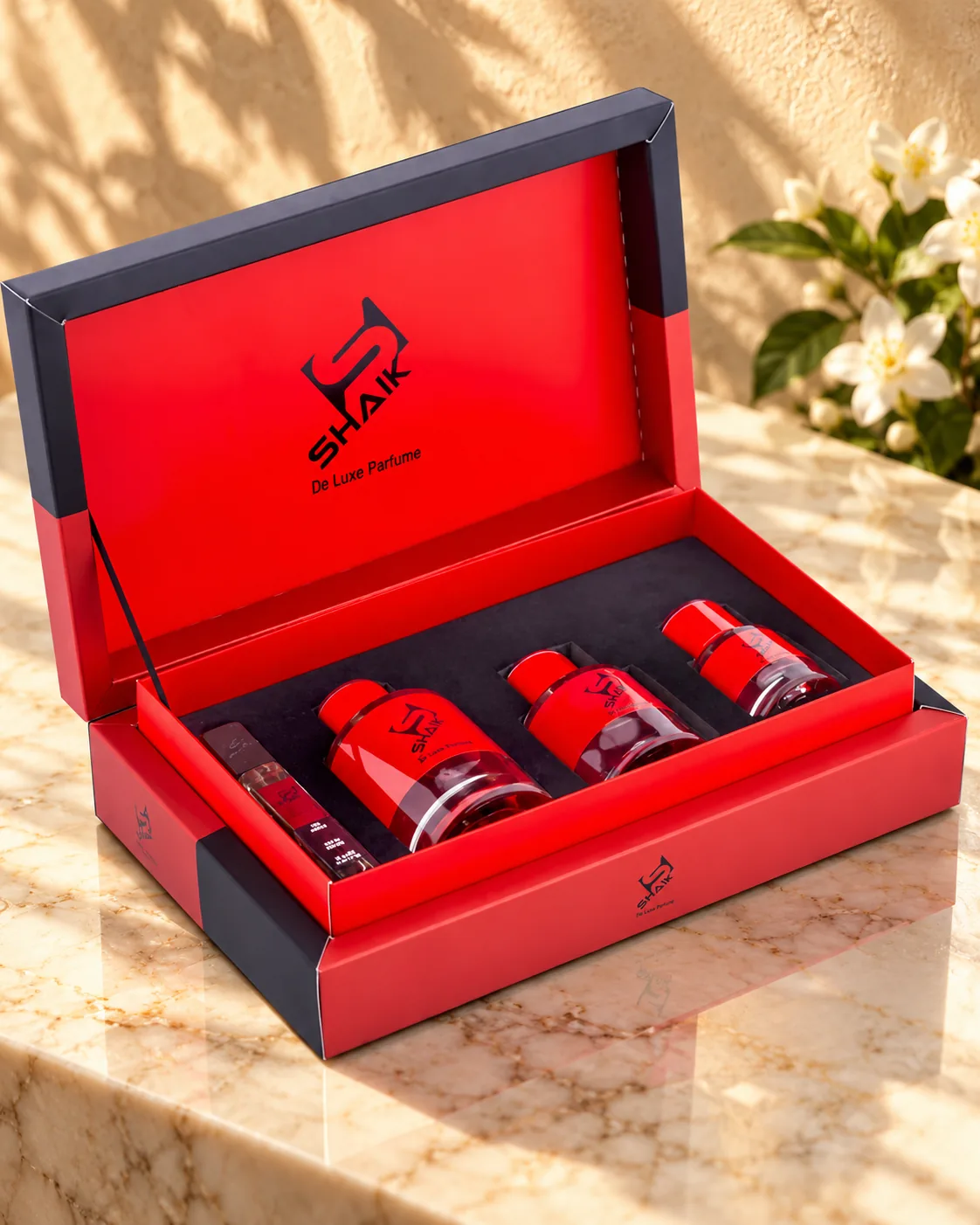 Shaik Gift Set No. 3: red gift box with three perfumes and a travel spray, another view
