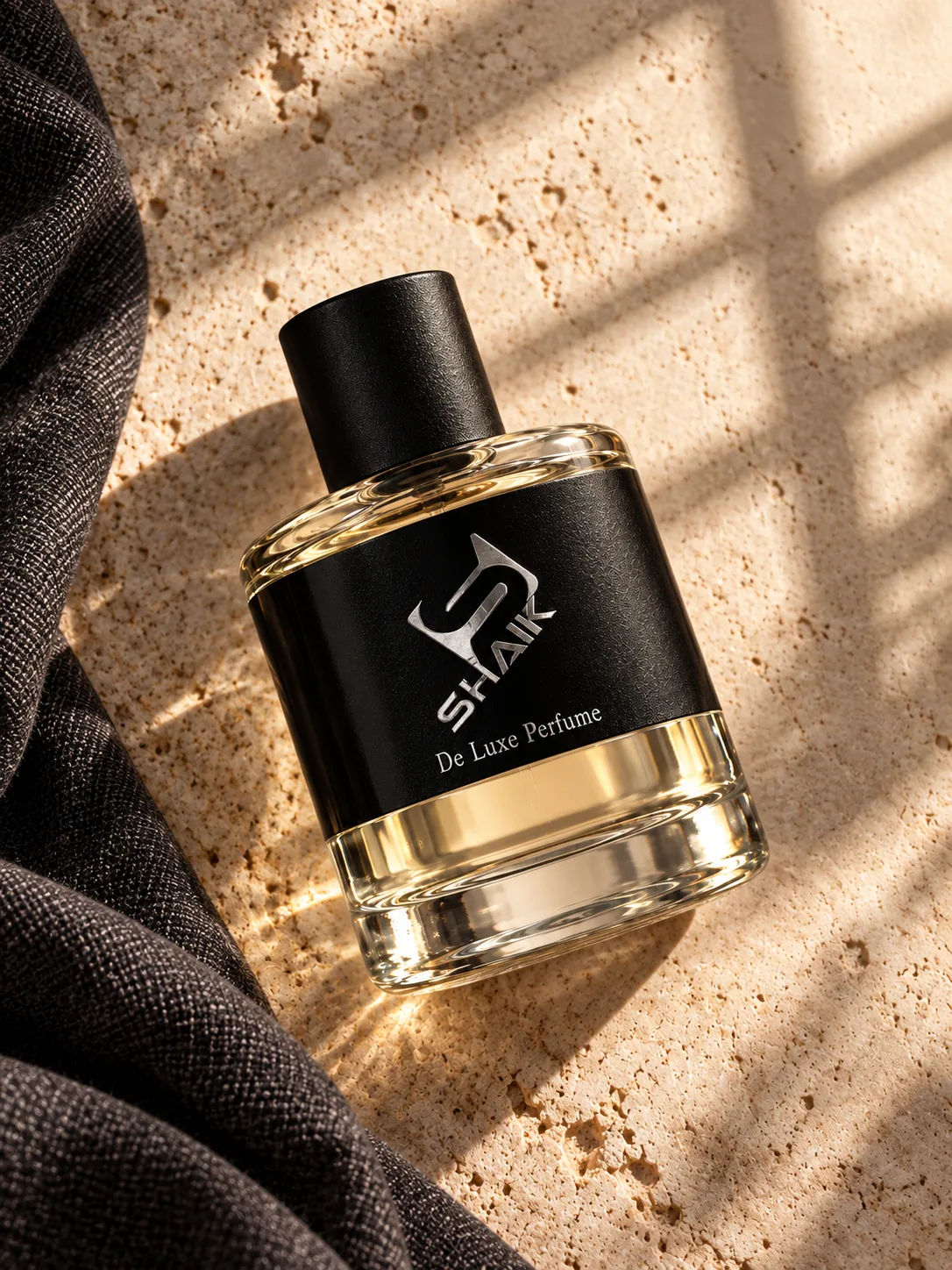Shaik men's perfume with black cap and label on dark linen