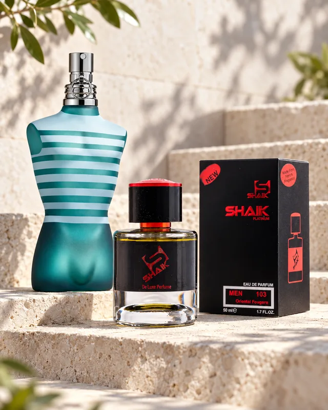 Shaik M 103 bottle and box beside Jean Paul Gaultier Le Male, the fragrance that inspired it