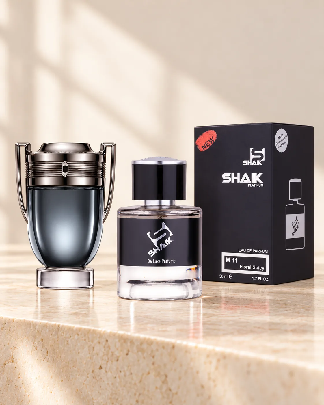 Shaik M 11 bottle and box beside Paco Rabanne Invictus Intense, the fragrance that inspired it
