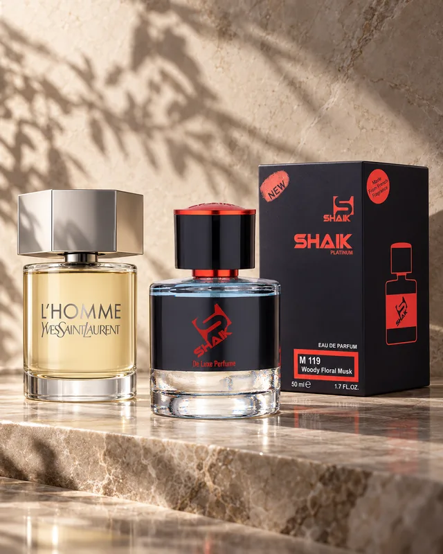 Shaik M 119 bottle and box beside Yves Saint Laurent L'Homme, the fragrance that inspired it