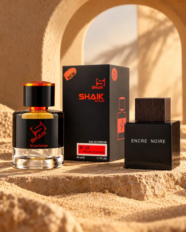 Shaik M 129 bottle and box beside Lalique Encre Noire, the fragrance that inspired it