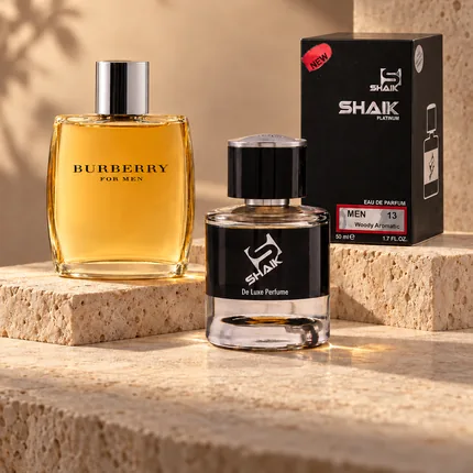 Shaik M 13 bottle and box beside Burberry Men, the fragrance that inspired it