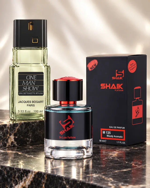 Shaik M 135 bottle and box beside Jacques Bogart One Man Show, the fragrance that inspired it