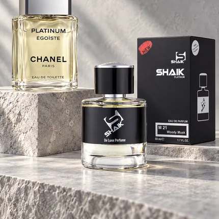 Shaik M 21 bottle and box beside Chanel Egoiste Platinum, the fragrance that inspired it