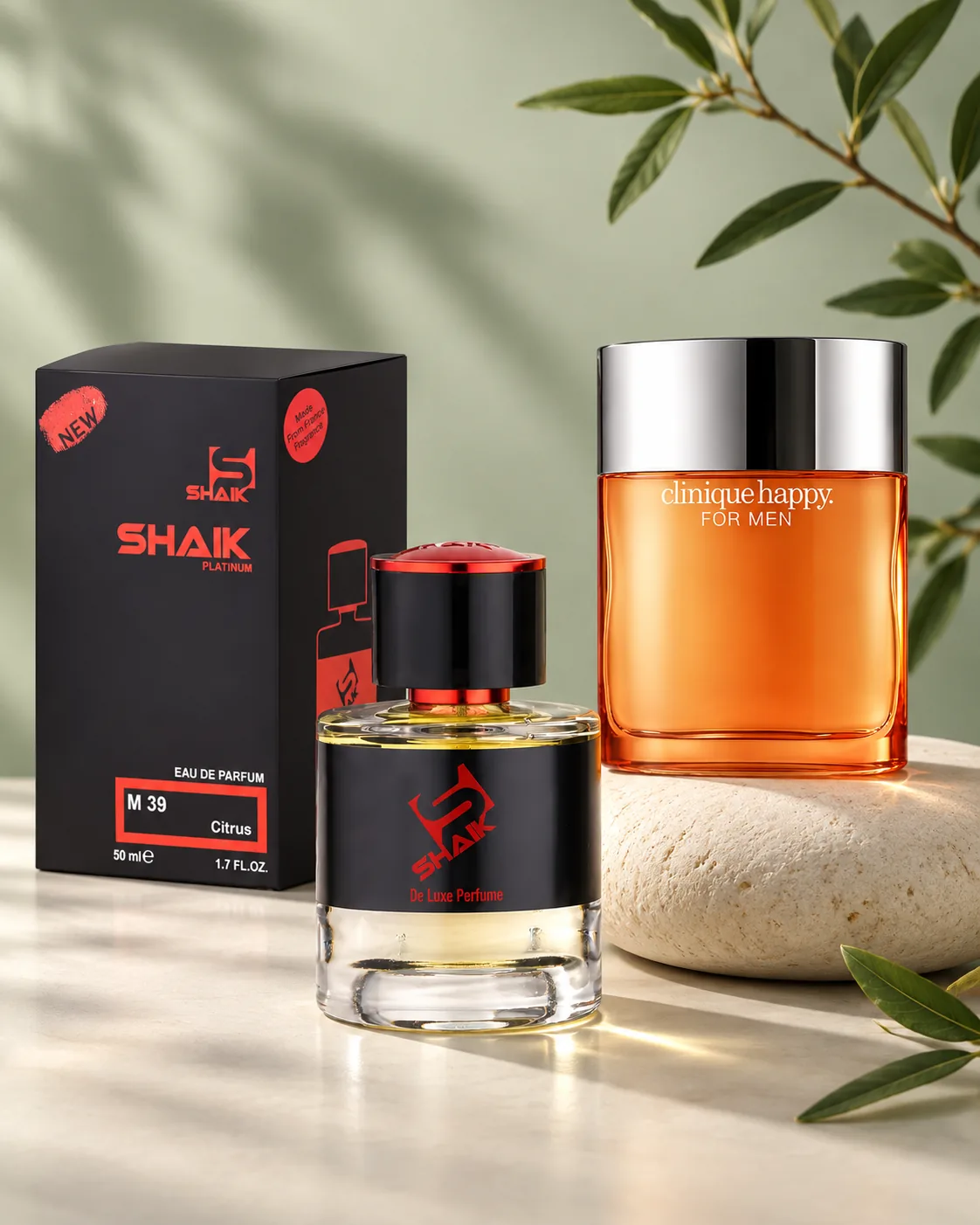 Shaik M 39 bottle and box beside Clinique Happy, the fragrance that inspired it