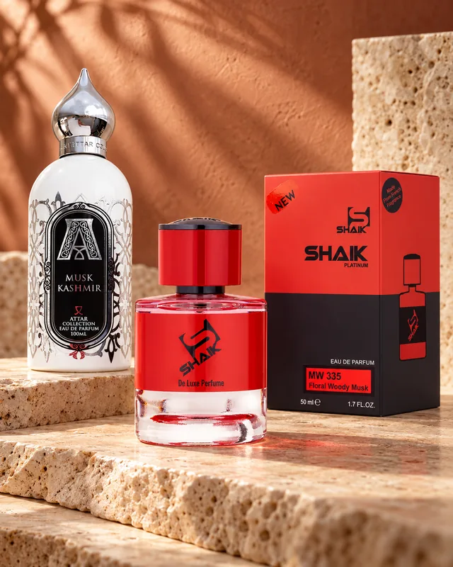 Shaik MW 335 bottle and box beside Attar Collection Musk Kashmir, the fragrance that inspired it