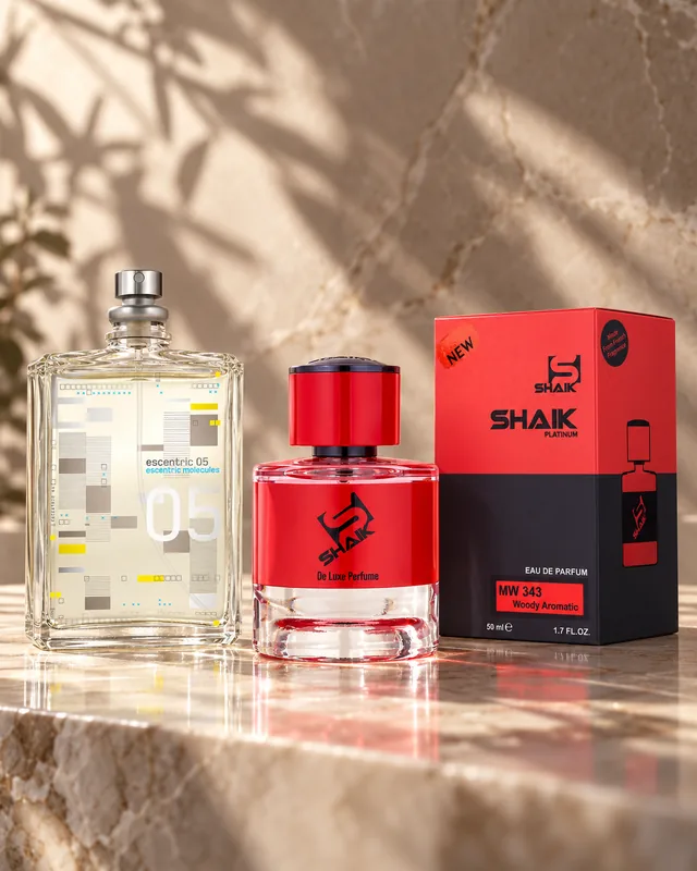 Shaik MW 343 bottle and box beside Escentric Molecules Escentric 05, the fragrance that inspired it