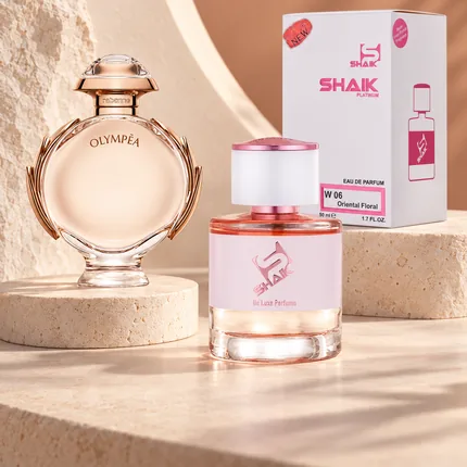 Shaik W 06 bottle and box beside Paco Rabanne Olympéa, the fragrance that inspired it