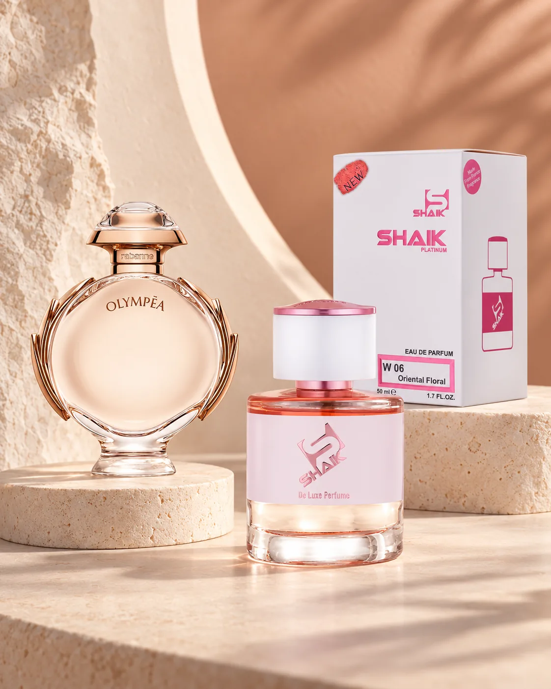 Shaik W 06 bottle and box beside Paco Rabanne Olympéa, the fragrance that inspired it