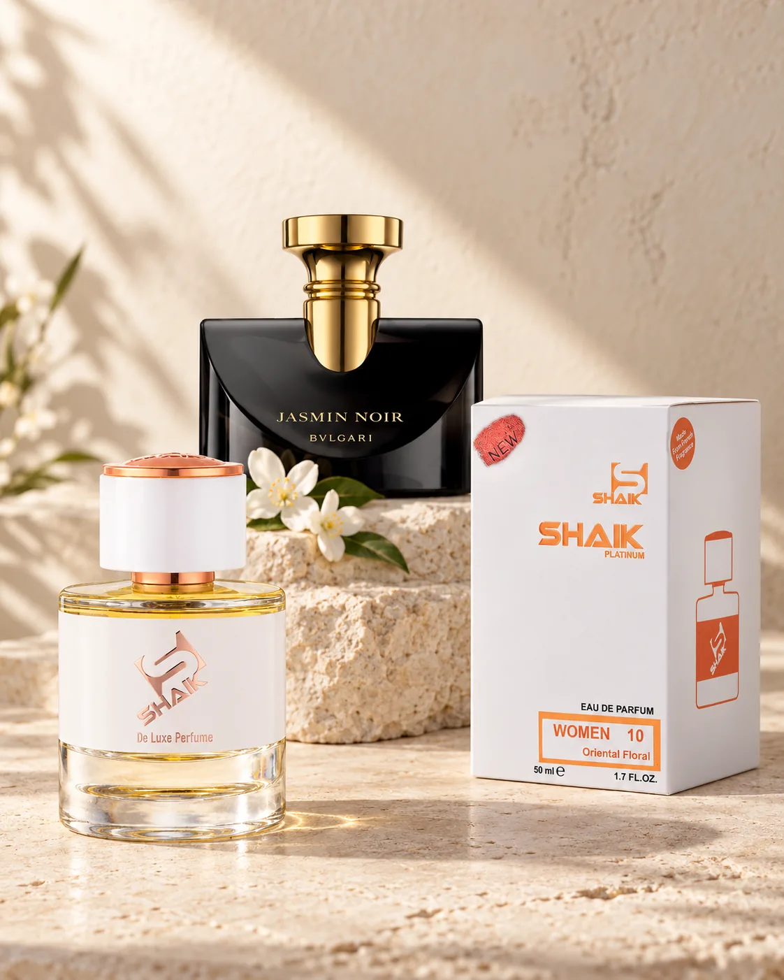 Shaik W 10 bottle and box beside Bvlgari Jasmin Noir, the fragrance that inspired it