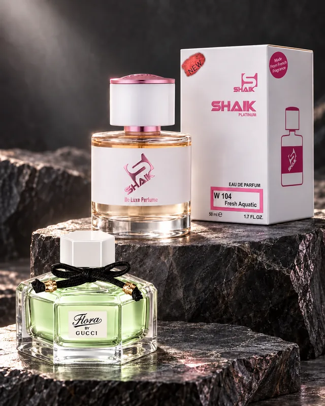 Shaik W 104 bottle and box beside Flora by Gucci Eau Fraîche, the fragrance that inspired it