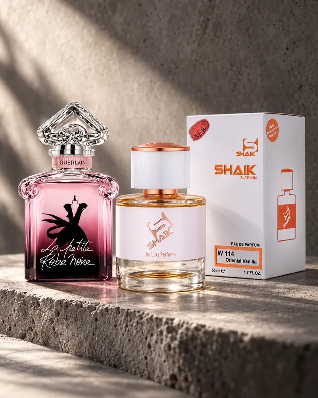 Shaik W 114 bottle and box beside Guerlain La Petite Robe Noire, the fragrance that inspired it