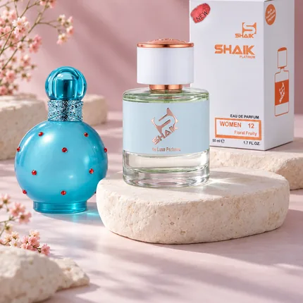 Shaik W 12 bottle and box beside Britney Spears Circus Fantasy, the fragrance that inspired it