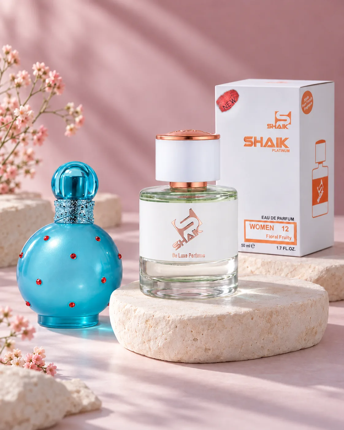 Shaik W 12 bottle and box beside Britney Spears Circus Fantasy, the fragrance that inspired it