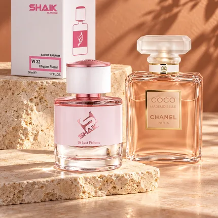 Shaik W 32 bottle and box beside Chanel Coco Mademoiselle, the fragrance that inspired it