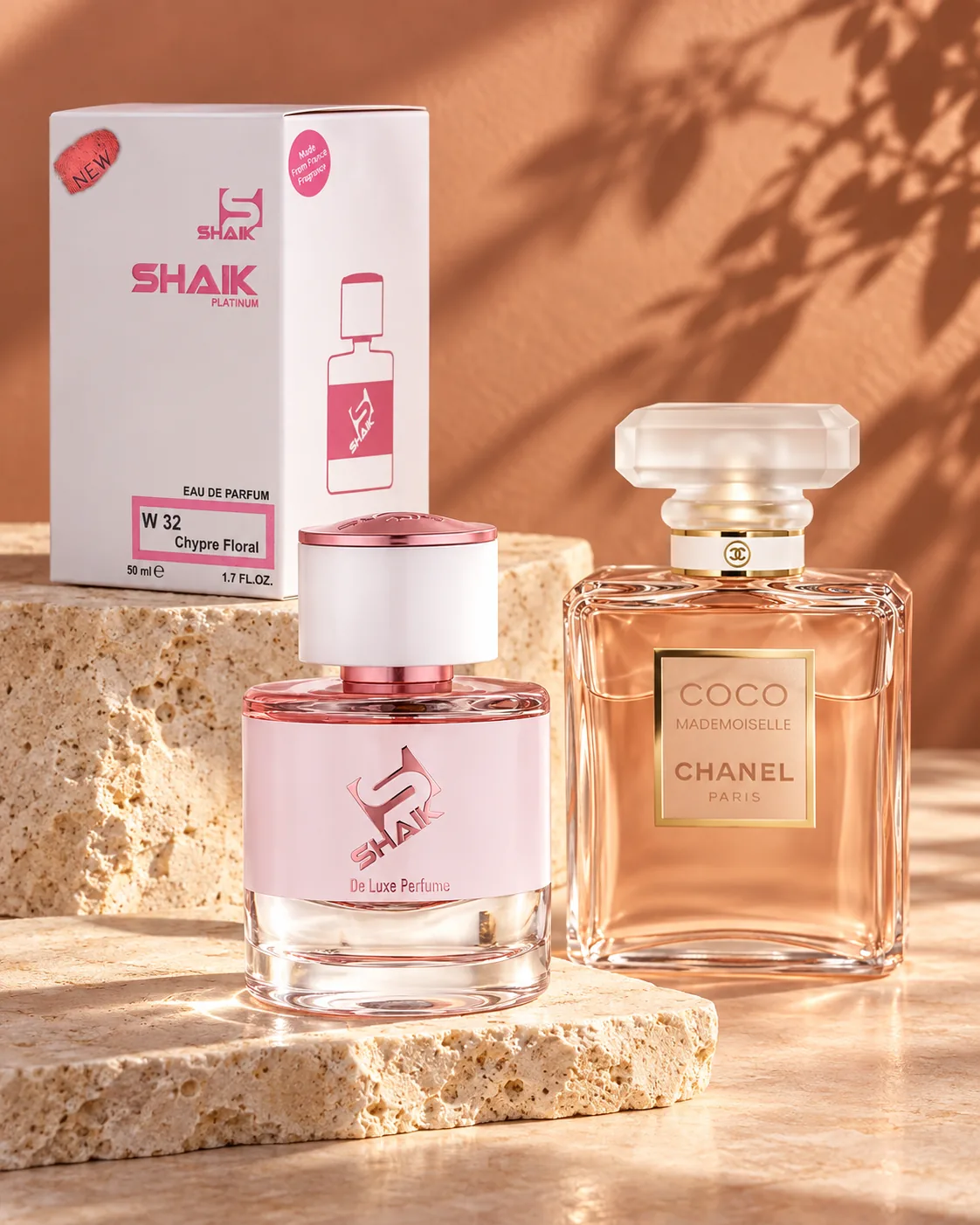 Shaik W 32 bottle and box beside Chanel Coco Mademoiselle, the fragrance that inspired it