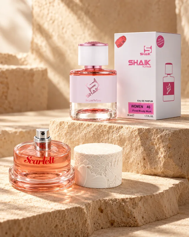 Shaik W 46 bottle and box beside Cacharel Scarlett, the fragrance that inspired it