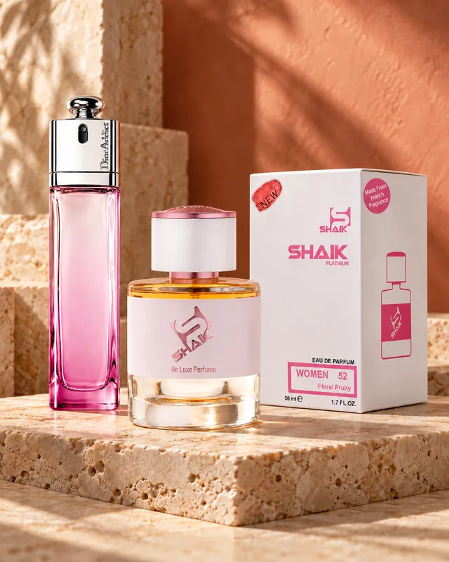 Shaik W 52 bottle and box beside Dior Addict 2, the fragrance that inspired it